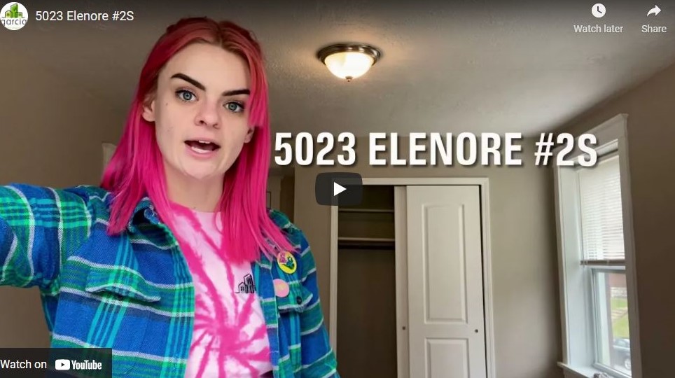 Youtube screenshot for apartment tour by woman with pink hair